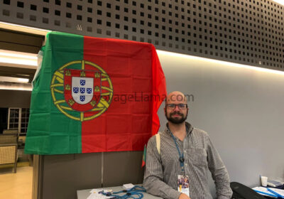 Flag of Portugal with man standing behind